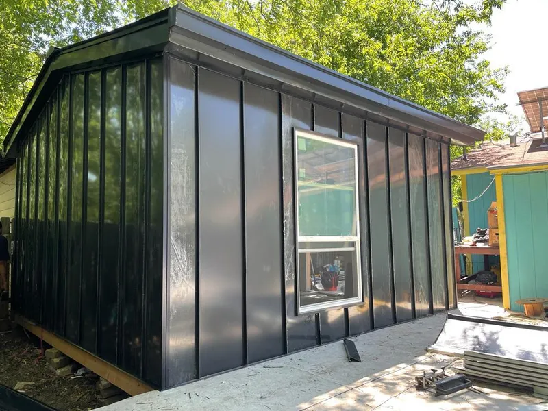 Black standing seam metal wall panels for Roof Inspection in Keene